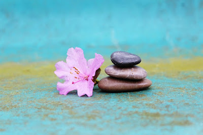 image: https://pixabay.com/photos/azalea-stack-of-stones-stack-stones-1307643/