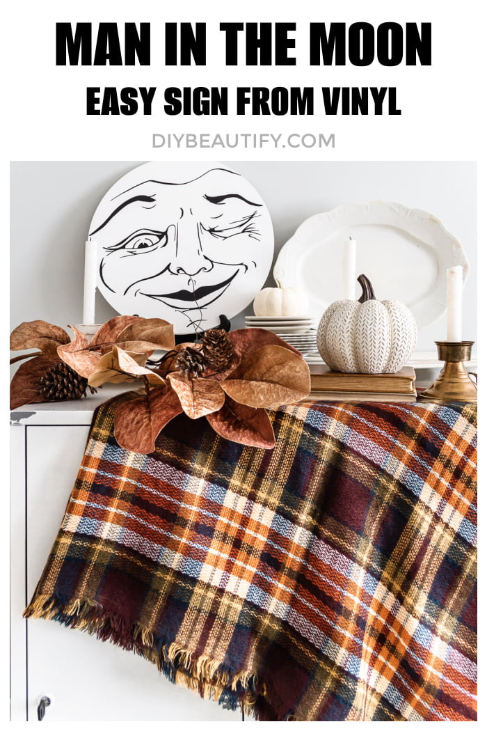 man in the moon white and black sign, plaid throw, fall leaves, candles, pumpkin