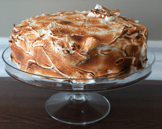 Lemon Meringue Cake on a glass cake topper