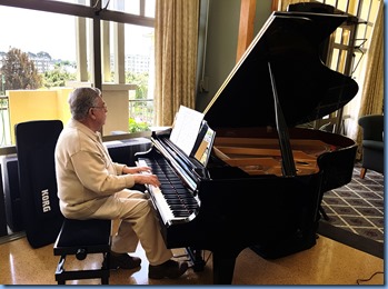 Jim Nicholson playing the K. Kawai grand piano.