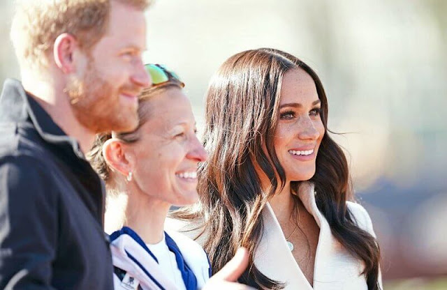 Meghan Markle wore a white belted jacket from Brandon Maxwell Fall-2022 collection. Prince Harry met athletes and organisers
