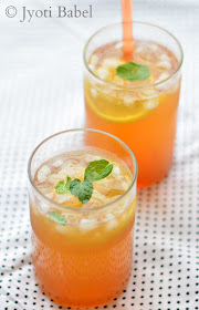 Herbal Ice Tea is a thrist-quenching summer drink. With lemongrass, ginger and mint, this herbal ice tea is full of flavours. Find my Herbal Ice Tea Recipe on www.jyotibabel.com