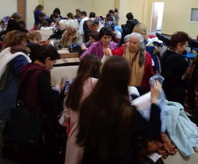 Israelis in need browsing clothing aisles at Haifa Aid Center