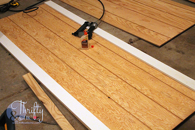 DIY barn door tutorial for sliding double barn doors! Make one of these doors for under $70!