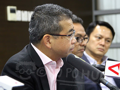 MP Edwin Tong addressing the media