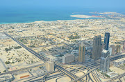 Walking around the observation deck there is barely an inch of Dubai that . (dubai )