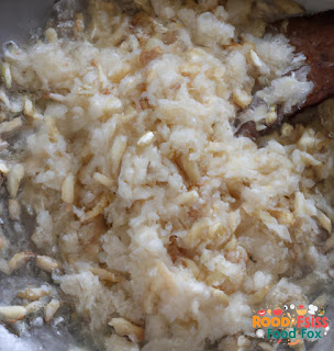 The chopped onion, garlic, and ginger being sautéed in coconut oil until fragrant.