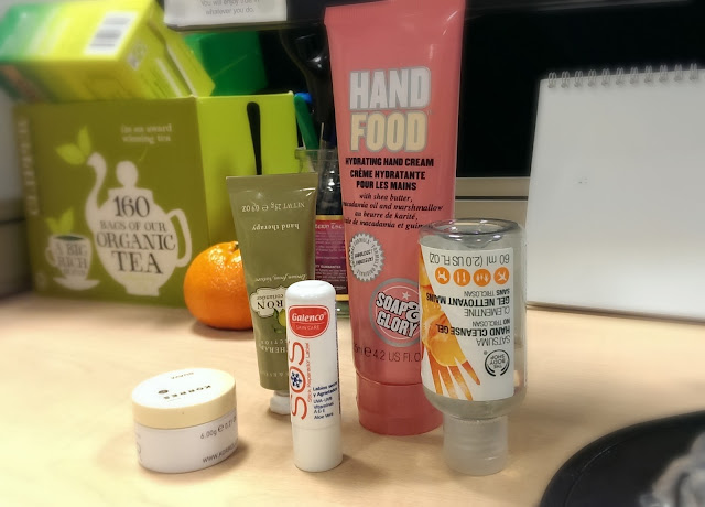 A collection of hand & lip products for the desk