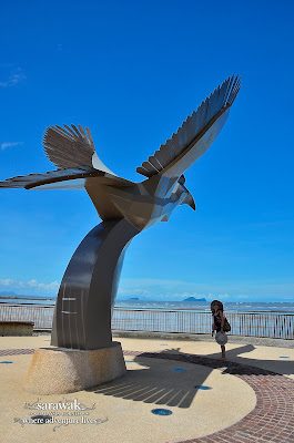 Giant hornbill statue against the azure sky; Damai Central