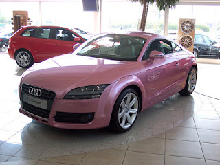 light pink audi car with dark coloured car