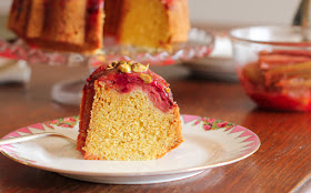 Food Lust People Love: Orange almond cake batter is spooned onto sweet roasted rhubarb and baked to golden perfection for a beautiful dessert your whole family will adore. Drizzled with the sticky rhubarb syrup and topped with chopped pistachios for a hit of color and crunch, this roasted rhubarb upside down cake is our new favorite sweet treat.