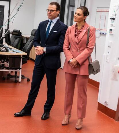 Princess Victoria wore Rodebjer pink suit, blazer and trousers. Rodebjer Xilla silk blouse. Dulong, Kreuger Jewellery pink earrings