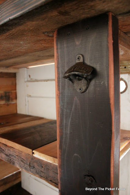 bottle opener, rustic bar, barnwood, http://bec4-beyondthepicketfence.blogspot.com/2016/03/rustic-old-door-bar-diy.html