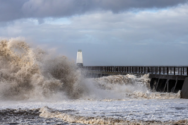 Photo of big waves whipped up by Storm Ciara crashing onto the shore at Maryport in Cumbria, UK