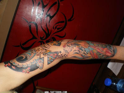Melodious Tattoo For Free Design Tattooed in the Arm