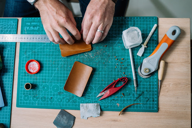 Top-down view of a leather crafting workbench