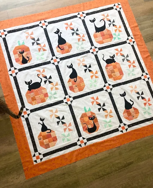 halloween quilt with pumpkins and cats