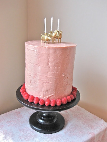 Fun candles on pink cake