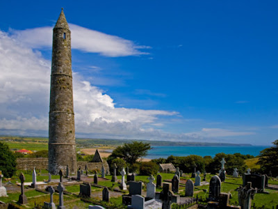 Ardmore round tower in the Ardmore graveyard overlooking the sea, Ardmore, County Cork, Ireland