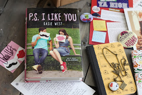August OwlCrate box with a theme YA High aka realistic/contemporary fiction story.  There is book fandom jewelry, Harry Potter artwork and pin, an adult coloring book, and the book PS I Like You by Kasie West with a letter and her signature.  Subscription Box, YA Lit, Teen reads, fun books, Alohamora Open a Book http://alohamoraopenabook.blogspot.com/