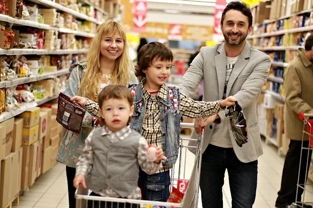 A family shopping in a grocery store.