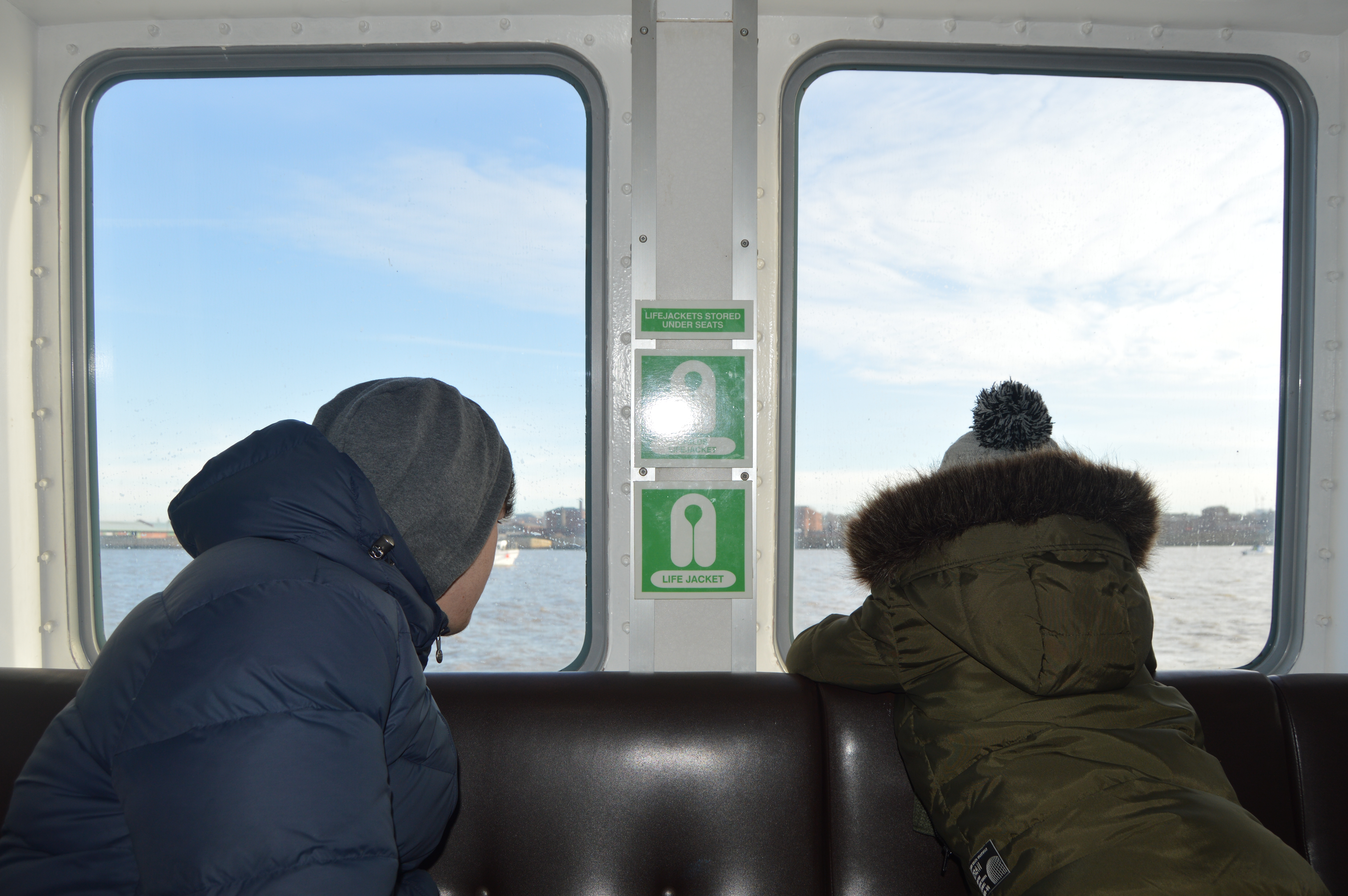 Boys looking out the ferry window