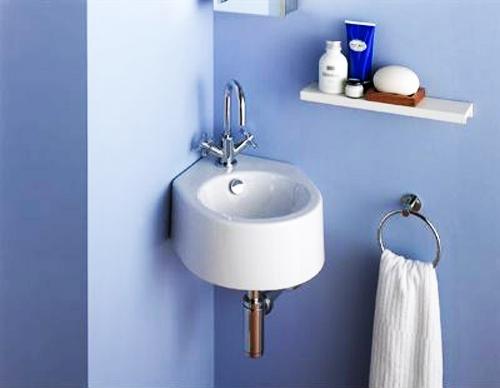 round shaped wall mounted corner sink for bathroom blue wall paint small towel holder