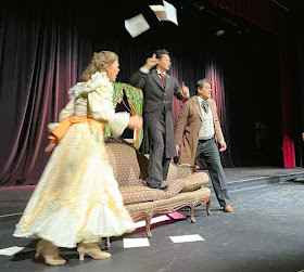 IN REVIEW: (from left to right) soprano SUSAN HELLMAN SPATAFORA as Rosalinde, tenor PAVEL SULAINDZIGA as Doktor Blind, and baritone KYLE PFORTMILLER as Gabriel von Eisenstein in Opera in Williamsburg's September 2023 production of Johann Strauss II's DIE FLEDERMAUS [Photograph © by Opera in Williamsburg]