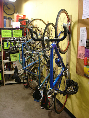 homemade bike rack in a hallway