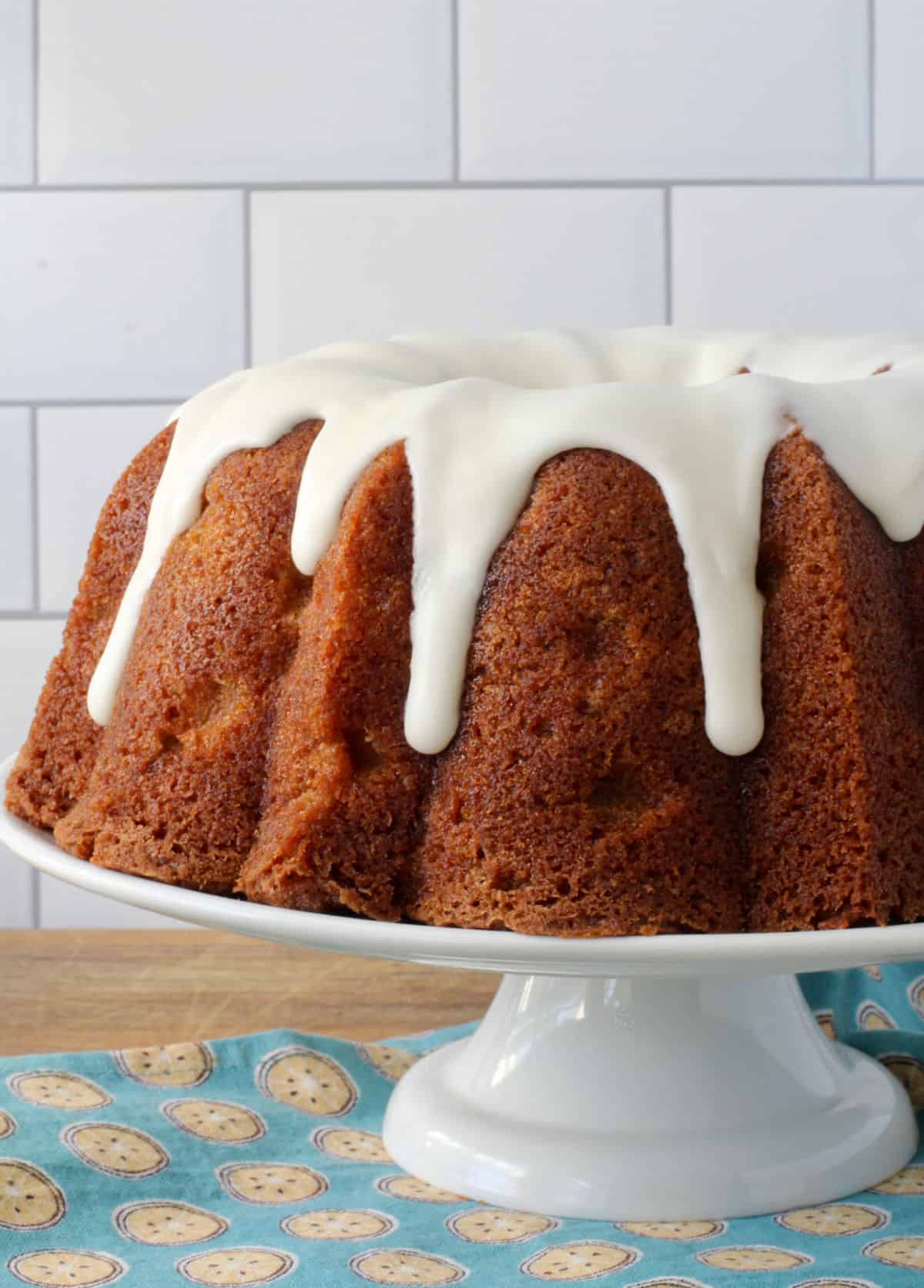 Apple Sour Cream Cake on a White Cake Stand.