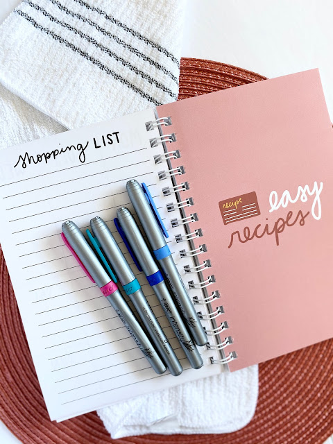 Pens laying on open meal planner