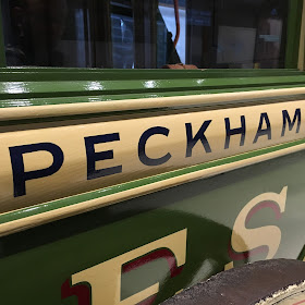 Hand-painted lettering on an old omnibus at the London Transport Museum