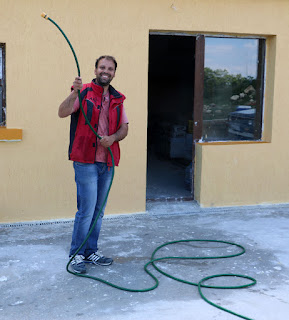 Ivan waving a hose around