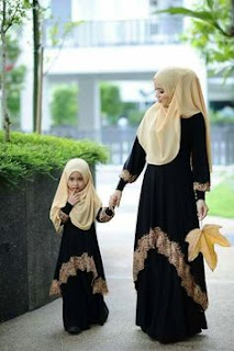 Abaya is a long loose dress. Women wear abaya when they go outside home. They wear abaya for coverin