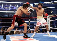 Manny Pacquiao, swings at Antonio Margarito