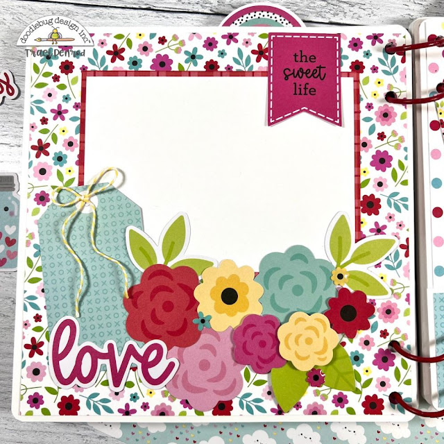 Valentine's Day Lots of Love scrapbook album page with flowers, tags, and twine