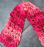 http://www.ravelry.com/patterns/library/snake-stitch-neck-warmer-or-scarf