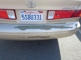Paint peeling off bumper on 2001 Toyota Camry.