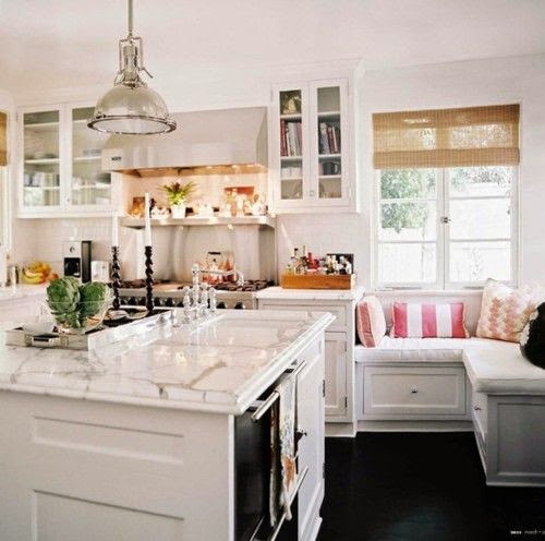 beautiful traditional kitchen with built in banquette dining table seating marble island