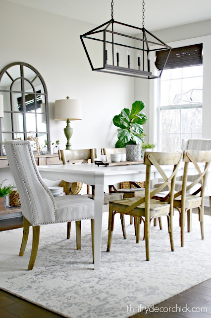 Pretty dining area with wood and white furniture 