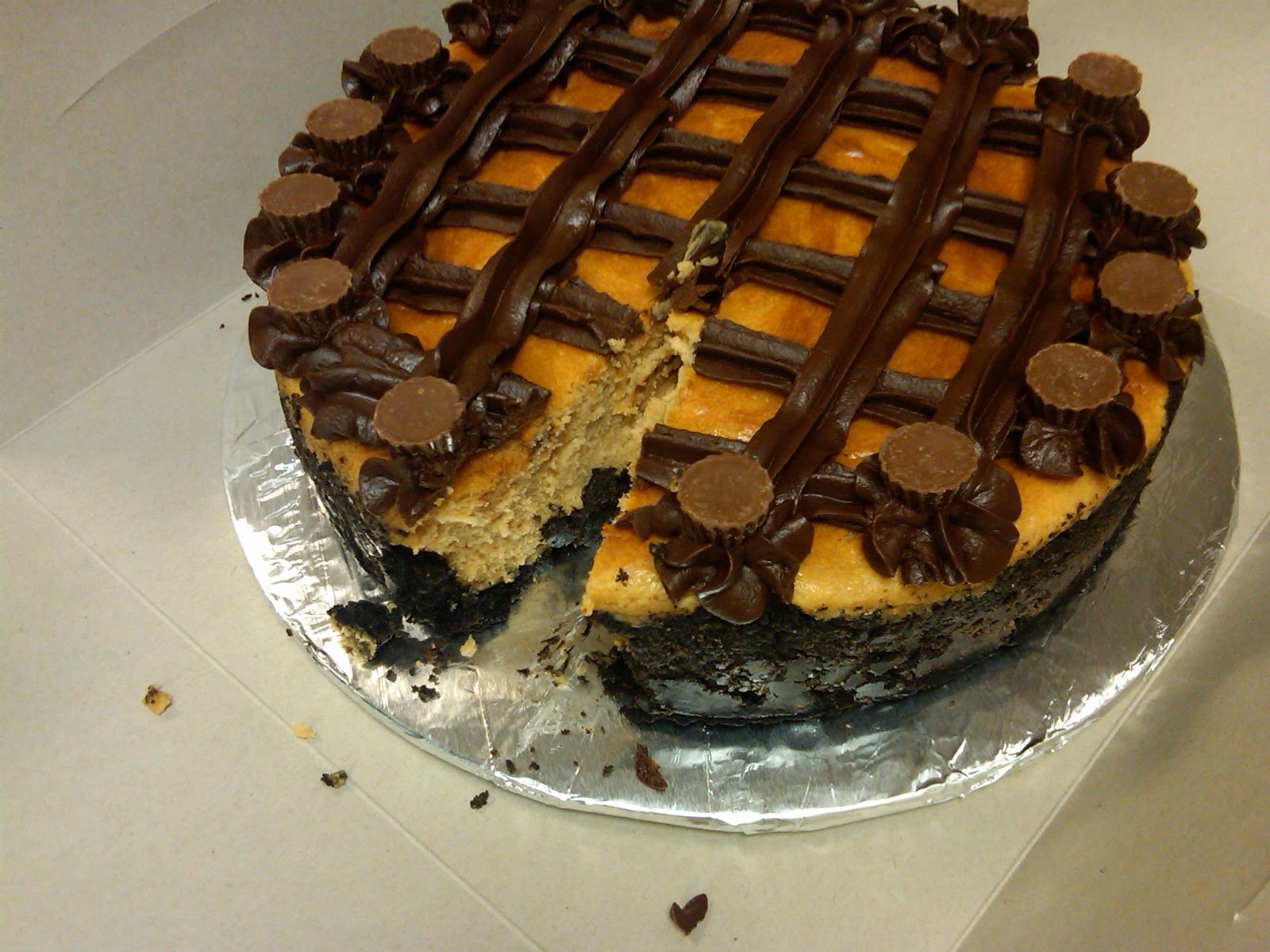 Peanut Butter Cheesecake topped with Chocolate Ganache Lattice