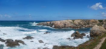 Atlantic rocky coastline, showing a surf area. Porto Covo, west coast of Portugal