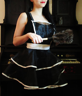 photo of Tish apron modeled in black organza and white satin trim