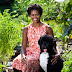 First Lady Michelle O. Poses for a Portrait with Bo Obama.