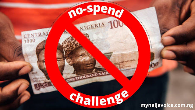 man holding naira note. Photo from My Nigerian Voice blog post how to do a no-spend challenge in Nigeria