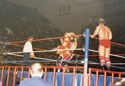 Ray Rougeau takes Bret Hart down with a flying cross body as Jacques, Jr. stands on the ring apron and ref Danny Davis prowls around the wrestling ring at Maple Leaf Gardens on December 26, 1986.