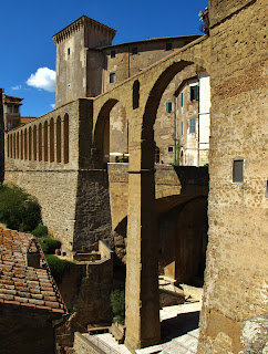 The Medicean Aquaduct  in front of the Orsini fortress in Pitigliano, Grosseto, Tuscany, Italy 