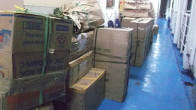 boxes and crates stacked along hallways of M/V Blessed Stars of Roble Shipping