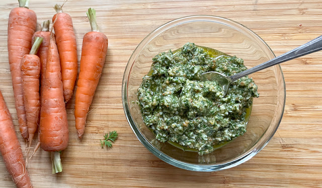 Food Lust People Love: Don’t waste those carrot tops, make pesto with them! Garlicky, cheesy and rich with toasted pine nuts, carrot greens pesto is a delicious way to take advantage of an ingredient many people cut off and throw away.