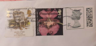 3 stamps adding up to 75p, the second class rate.